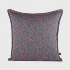 Cushion KULURI 50x50 in shades of purple with a colorful pattern and palette.